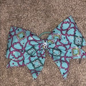 Light blue cheer bow with desgin